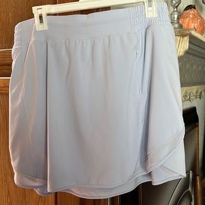 Lululemon size 14 multi pocket running skirt. Never worn but washed.
